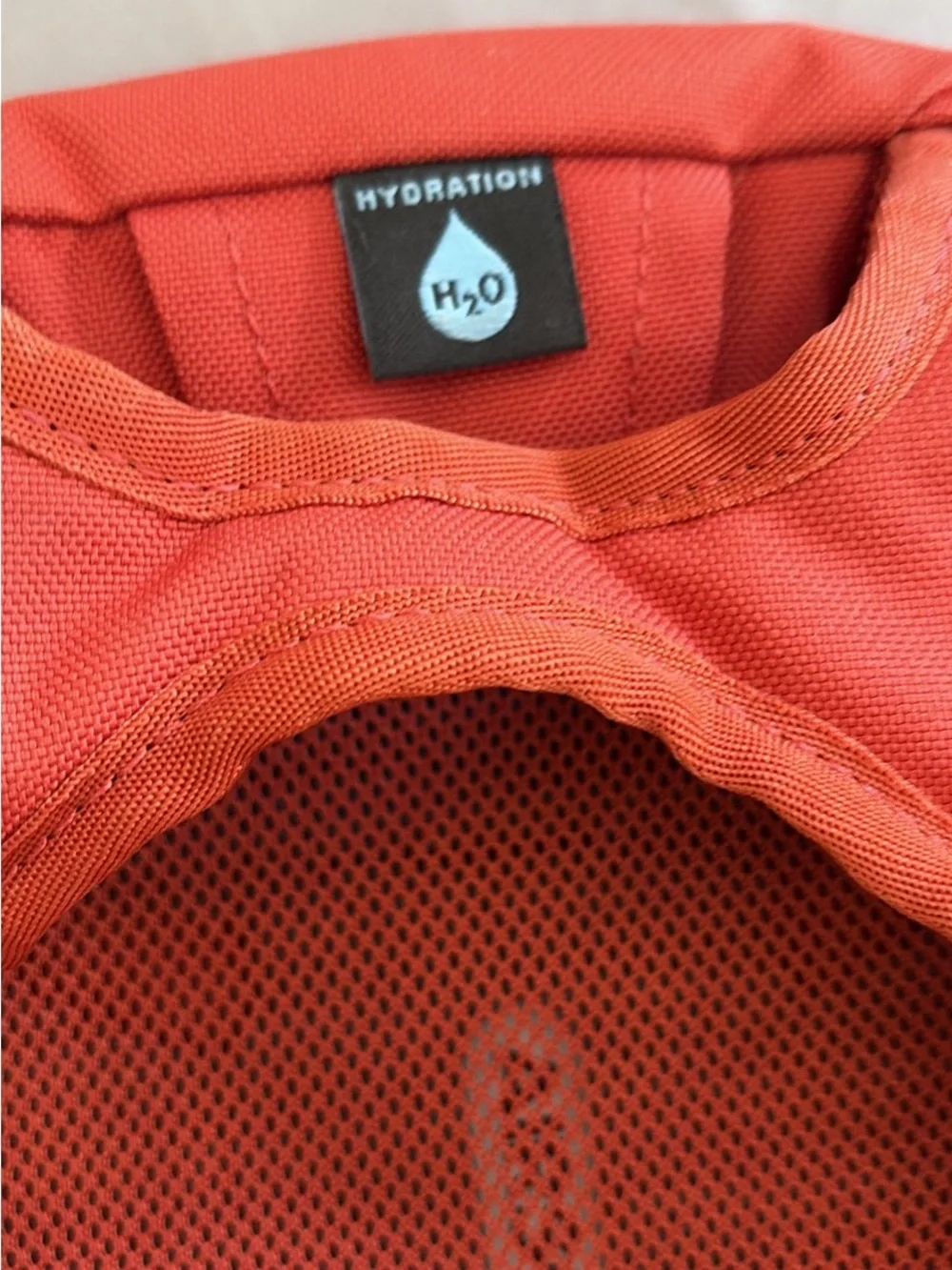 OSPREY Kids Daylite Jr Daypack in Bright Orange with Blue Hydration Reservoir